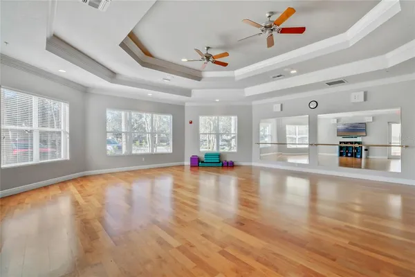 a view of a livingroom with workspace and a window