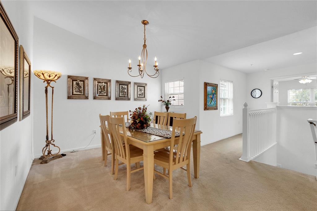 8310 Quimby Circle Davenport, FL 33896 - Photo 5 of 20 a view of a dining room with furniture and chandelier