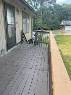 a view of a balcony with two chairs