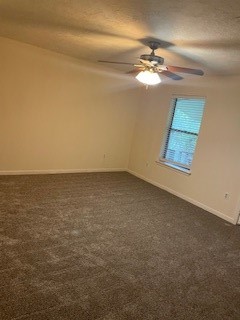 138 B Summer Place Huntsville, TX 77340 - Photo 6 of 17 an empty room with a fan and a window