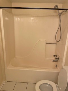 138 B Summer Place Huntsville, TX 77340 - Photo 7 of 17 a bathroom with a shower and a toilet