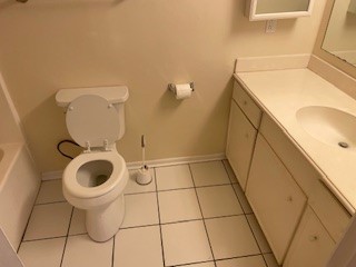 138 B Summer Place Huntsville, TX 77340 - Photo 9 of 17 a bathroom with a toilet and a sink
