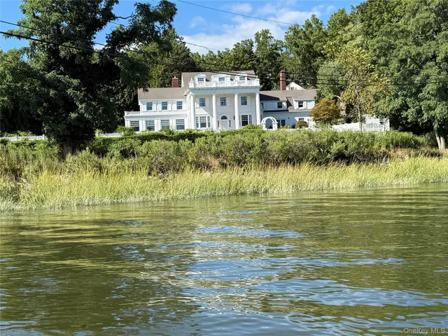 a front view of a house with a ocean view