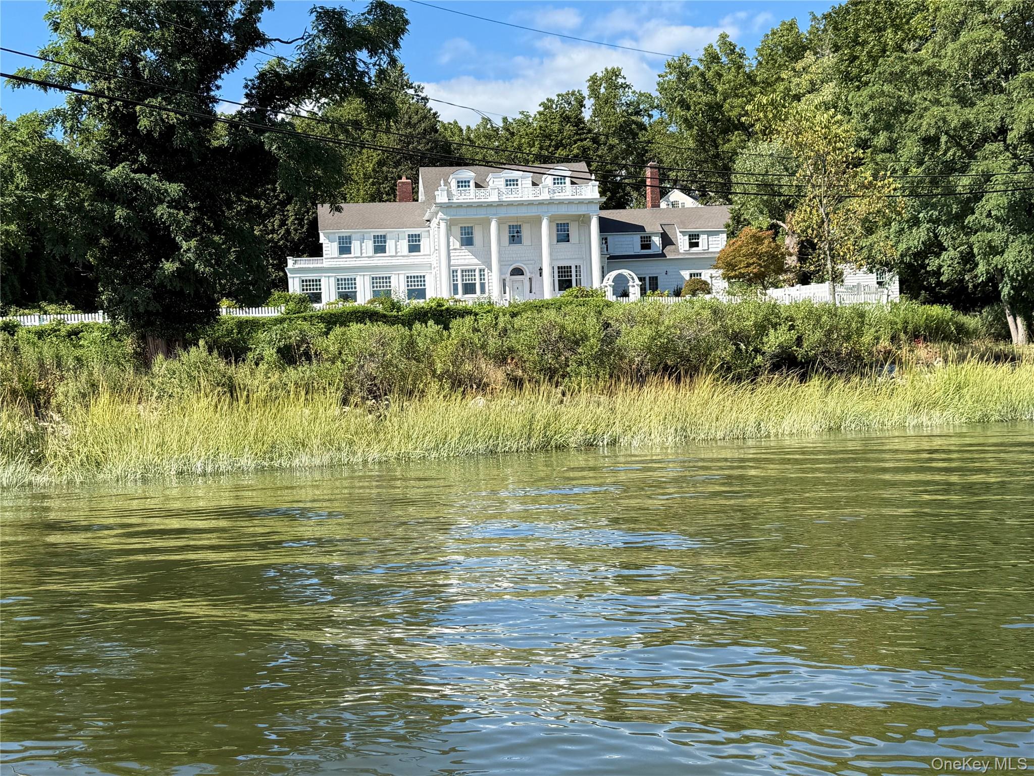 a front view of a house with a ocean view