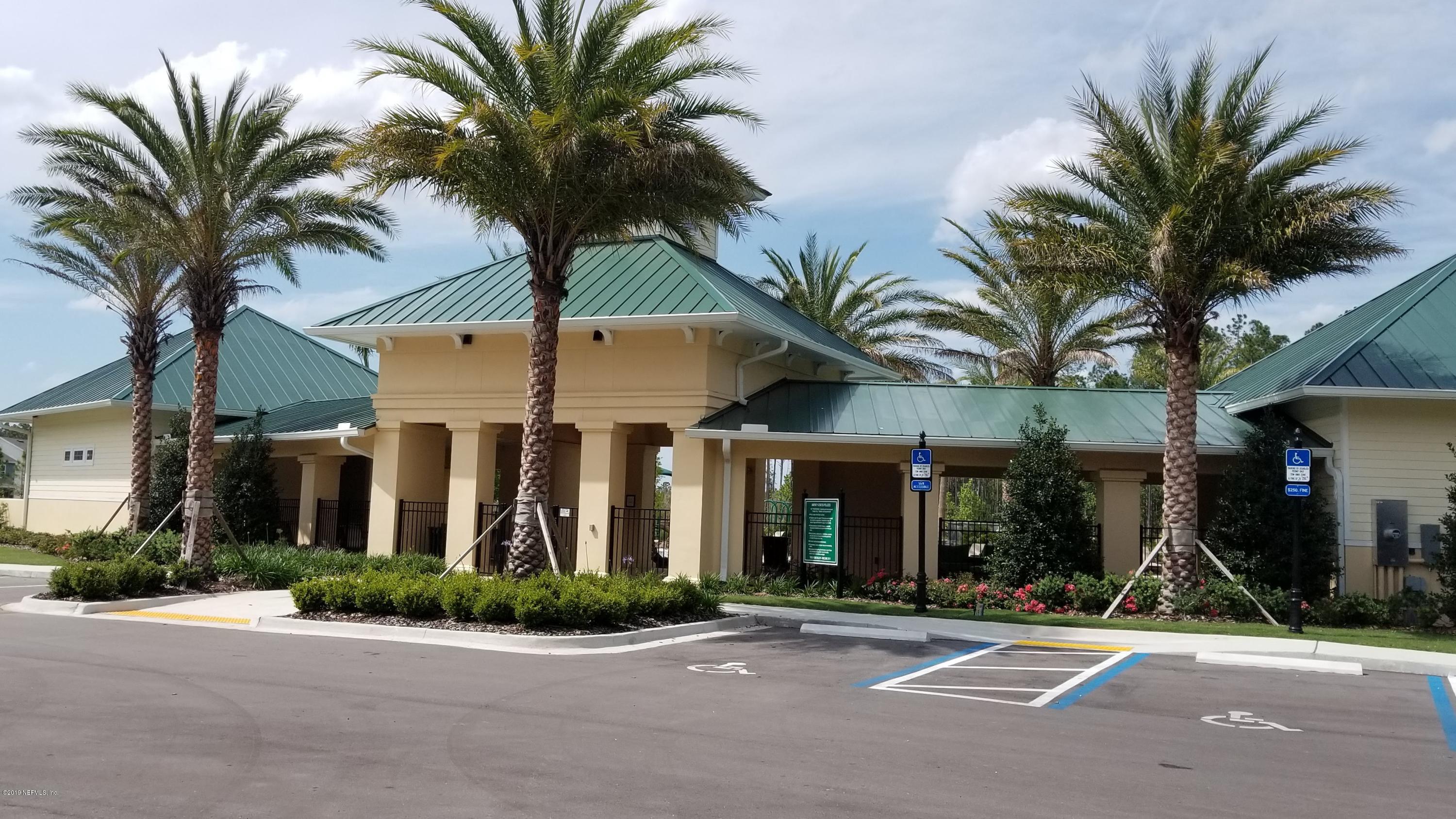684 Broomsedge Circle St. Augustine, FL 32095 - Photo 5 of 7 a view of a building with a palm tree