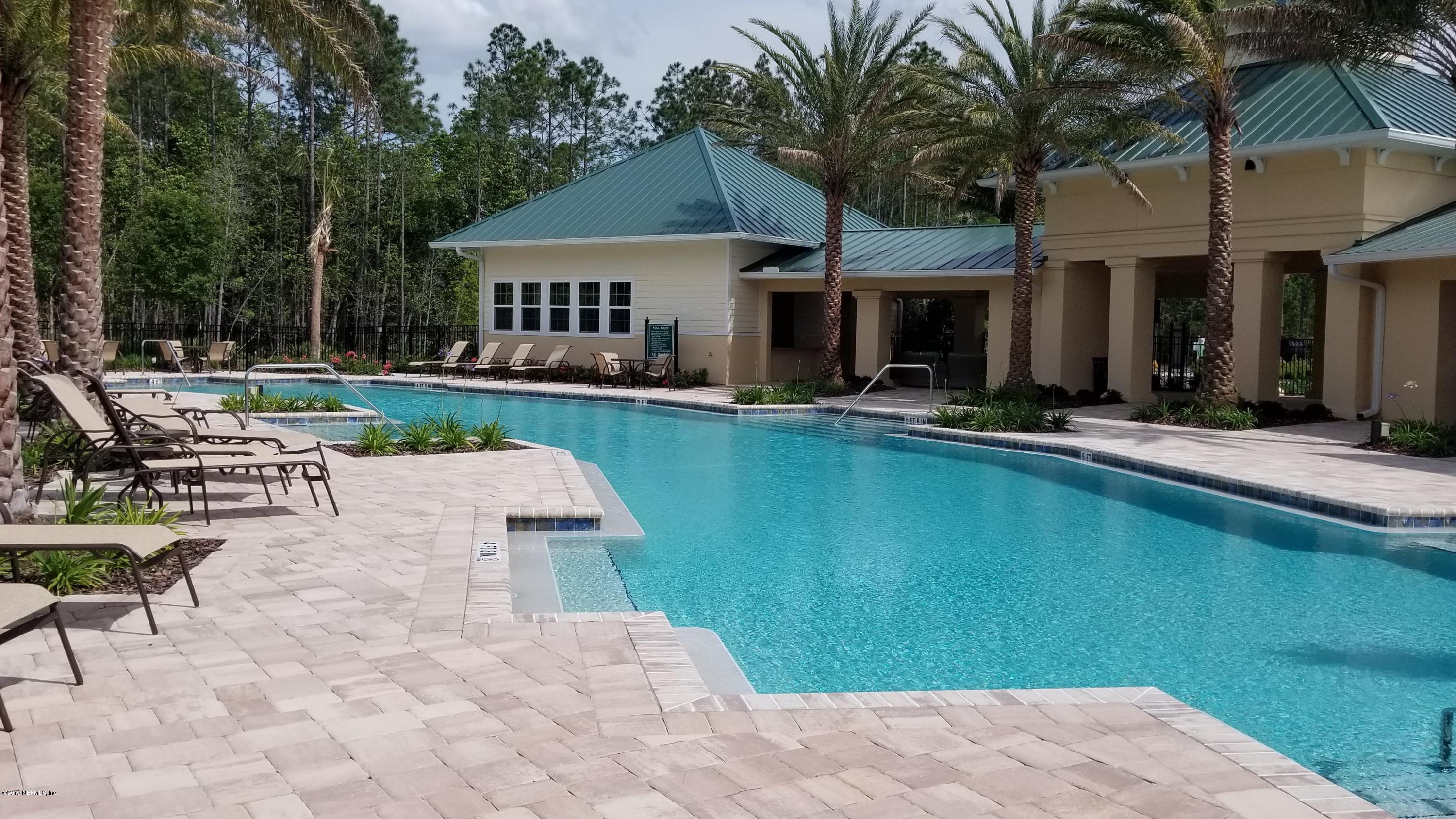 684 Broomsedge Circle St. Augustine, FL 32095 - Photo 6 of 7 a view of house with yard outdoor seating and swimming pool