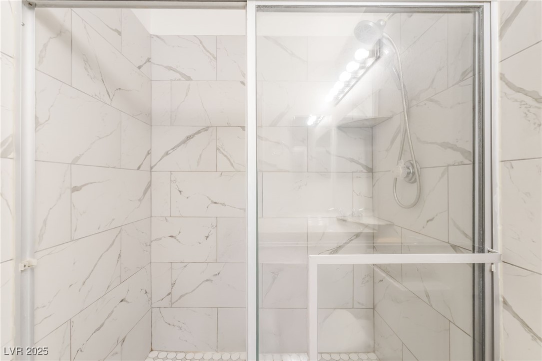 3151 North Soaring Gulls Drive, Unit 1083 Las Vegas, NV 89128 - Photo 24 of 45 Full bath featuring a marble finish shower