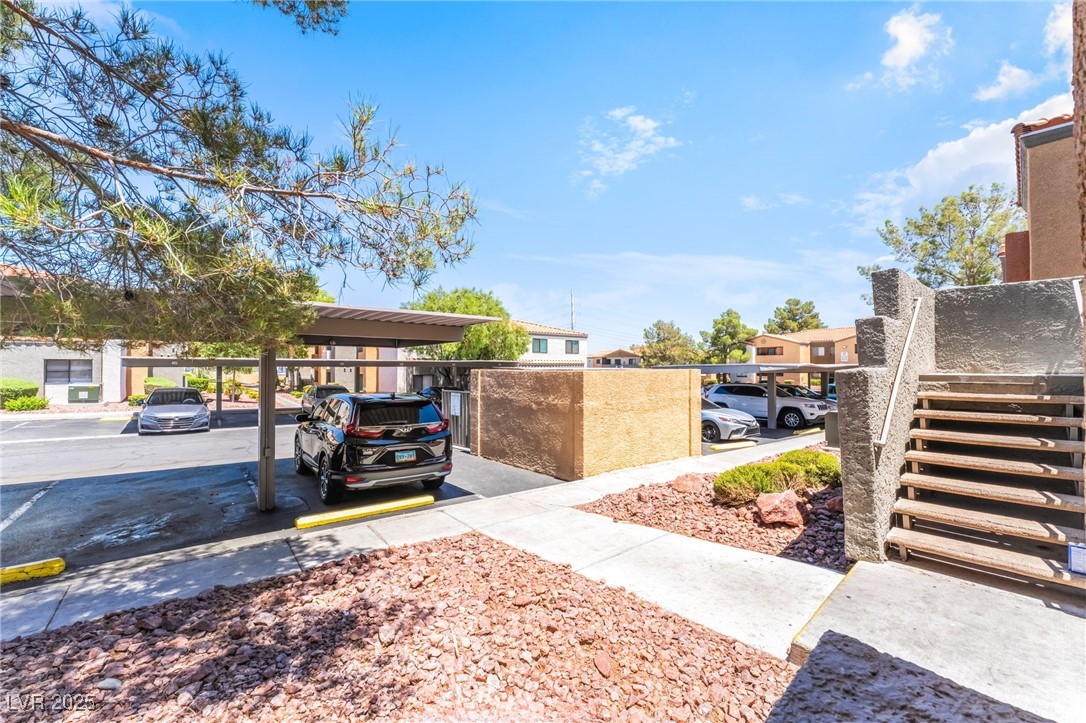 3151 North Soaring Gulls Drive, Unit 1083 Las Vegas, NV 89128 - Photo 34 of 45 View of yard featuring stairway and a residential view