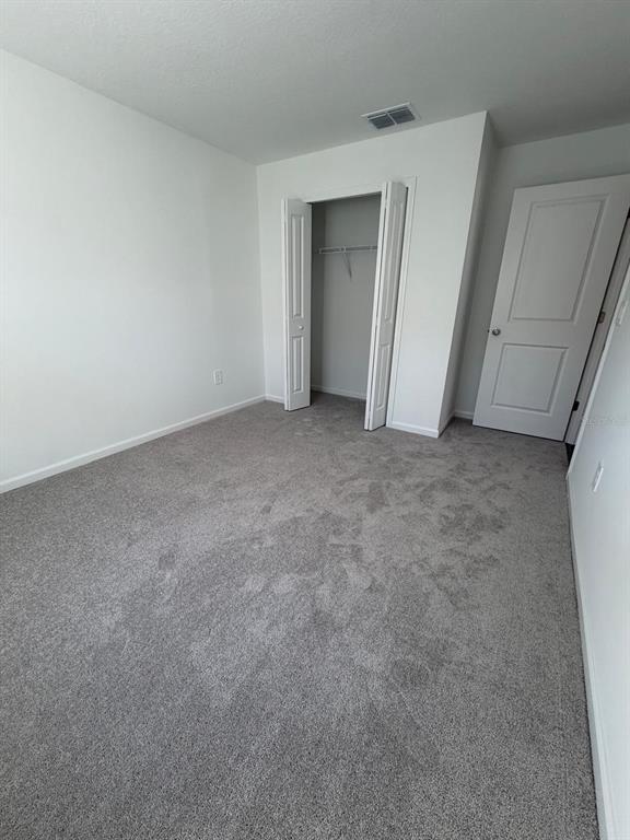 4741 Southwest 83rd Loop Ocala, FL 34476 - Photo 12 of 25 a view of an empty room and closet area