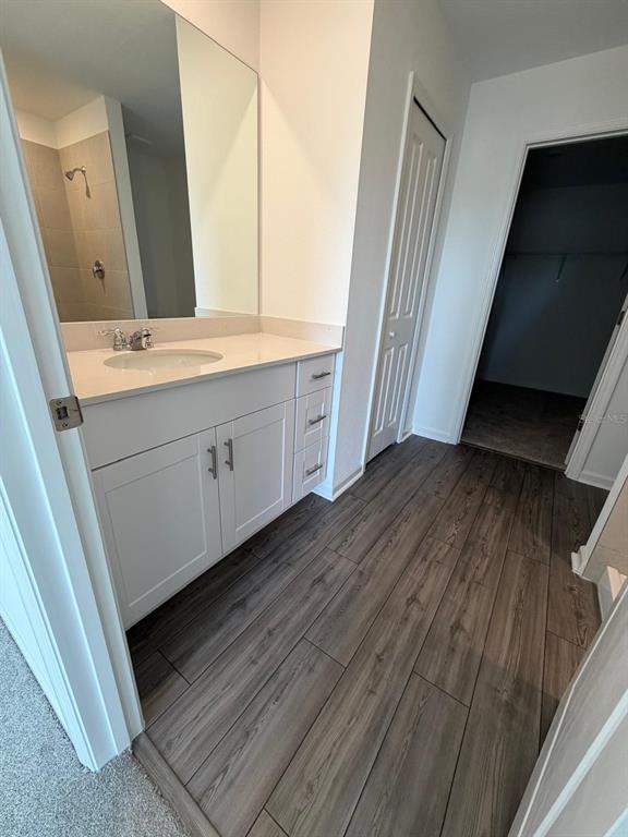 4741 Southwest 83rd Loop Ocala, FL 34476 - Photo 15 of 25 a bathroom with a double vanity sink and mirror