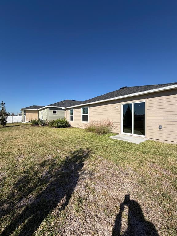 4741 Southwest 83rd Loop Ocala, FL 34476 - Photo 21 of 25 a view of a house with backyard