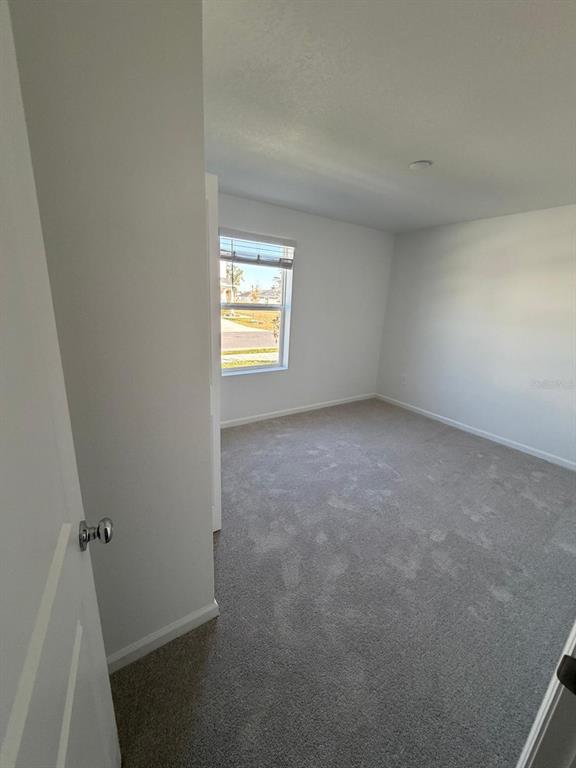 4741 Southwest 83rd Loop Ocala, FL 34476 - Photo 8 of 25 an empty room with windows