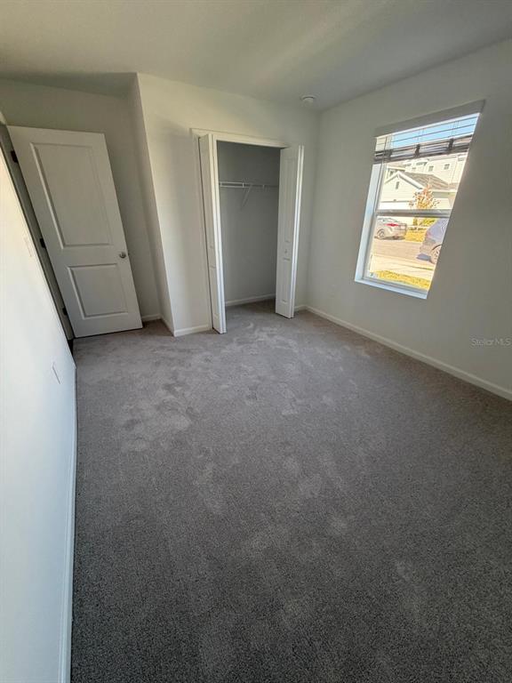 4741 Southwest 83rd Loop Ocala, FL 34476 - Photo 9 of 25 an empty room with windows