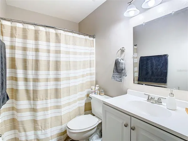 a bedroom with a bed and flat screen tv