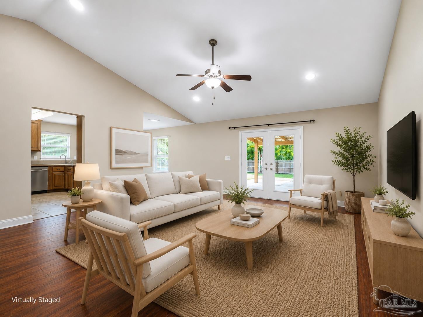 5567 Jones Street Milton, FL 32570 - Photo 48 of 48 a living room with furniture a chandelier and a flat screen tv