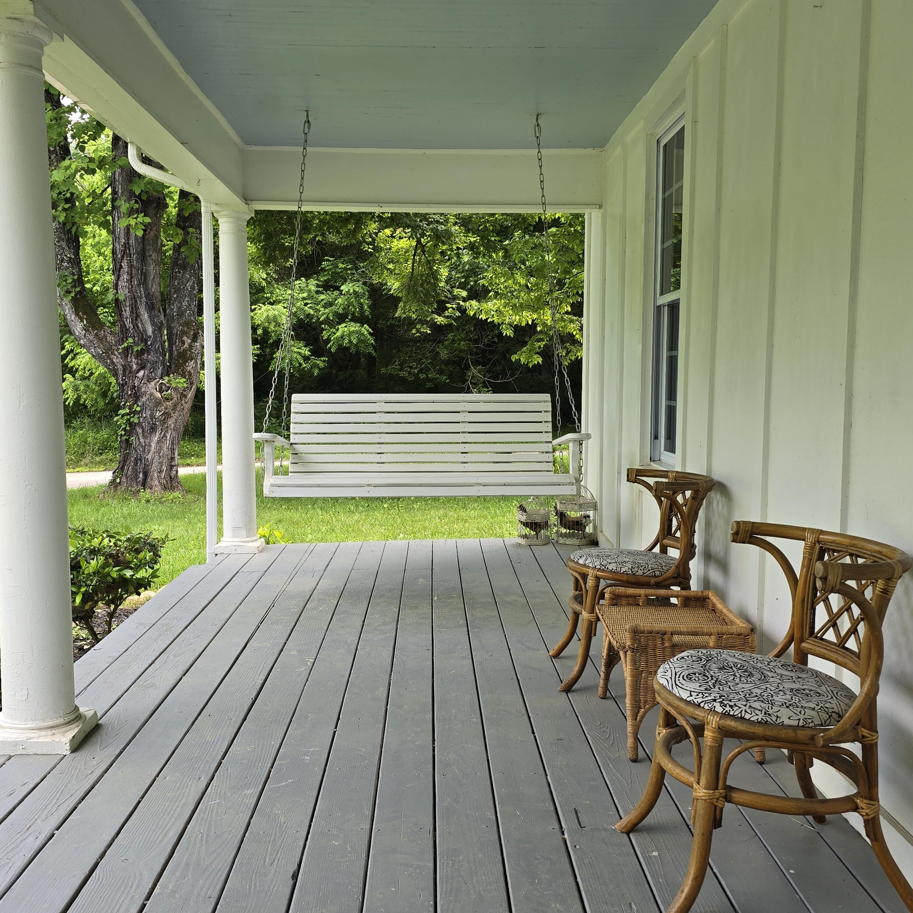3542 Persimmon Road Shawsville, VA 24162 - Photo 6 of 94 a view of balcony with chairs and wooden floor