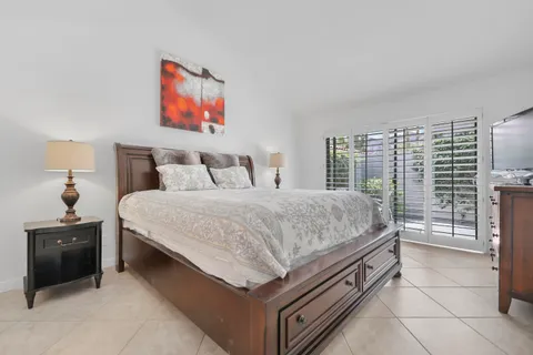 a bedroom with a bed and a desk