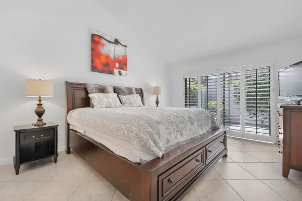 a bedroom with a bed and a desk