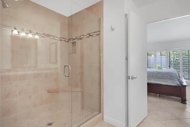 a bathroom with a shower and a sink