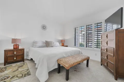 a bedroom with a bed and a cabinets