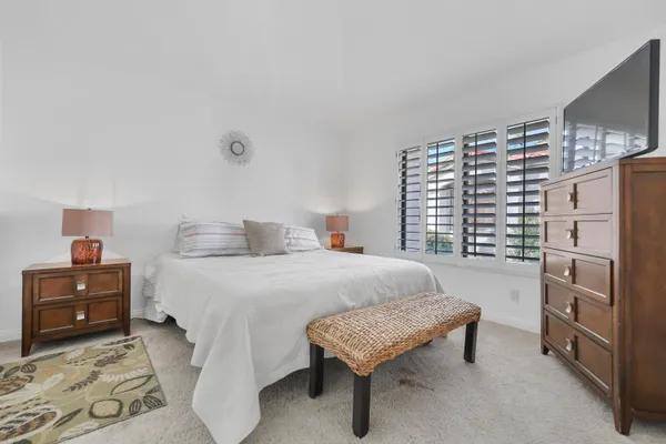 a bedroom with a bed and a cabinets