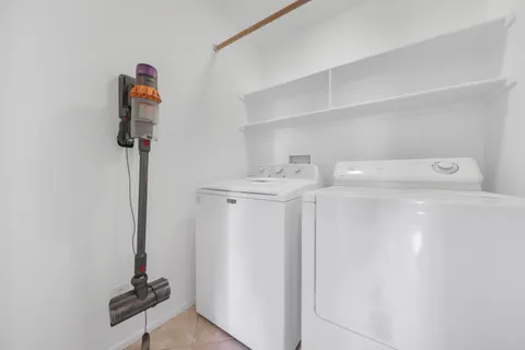 a view of storage and utility room with washer and dryer