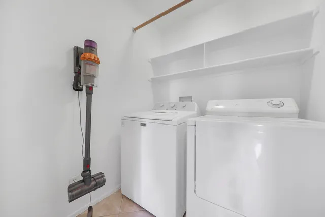 a view of storage and utility room with washer and dryer