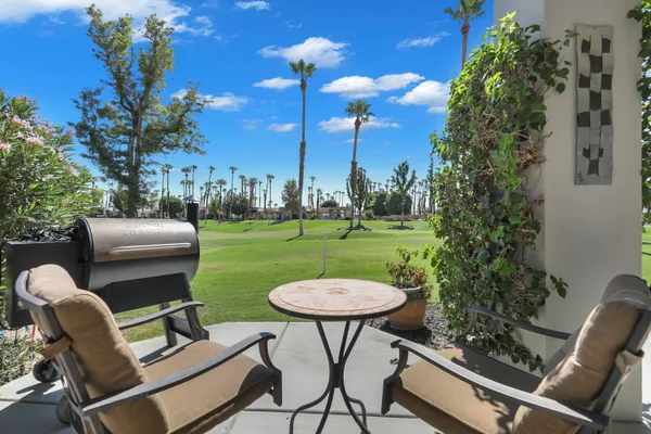 a view of a chairs and tables in the patio