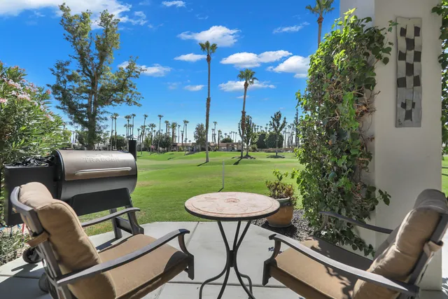 a view of a chairs and tables in the patio