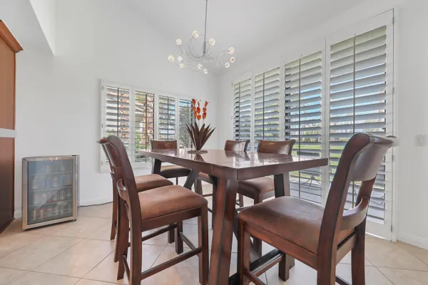 a view of a dining room with furniture and window