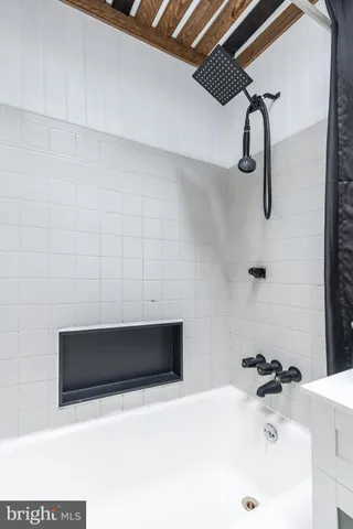 a bathroom with a sink and stainless steel appliances