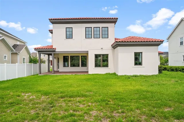 a view of a storage & utility room a window and a ceiling fan