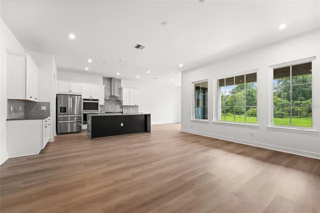a view of kitchen with wooden floor