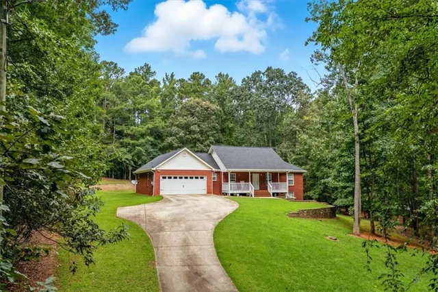 a front view of a house with yard