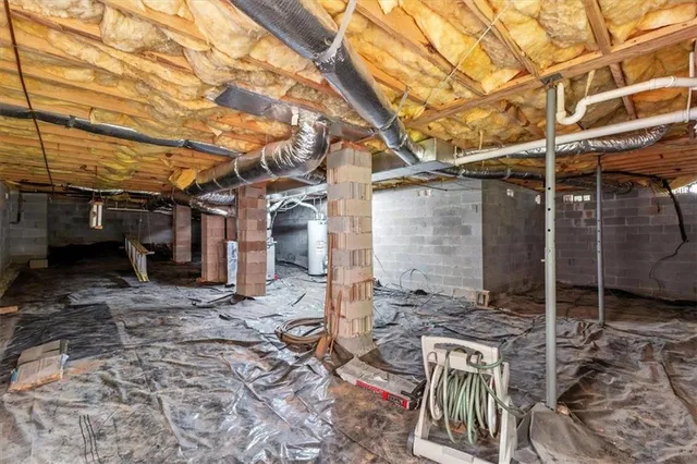 a view of a backyard with wooden fence