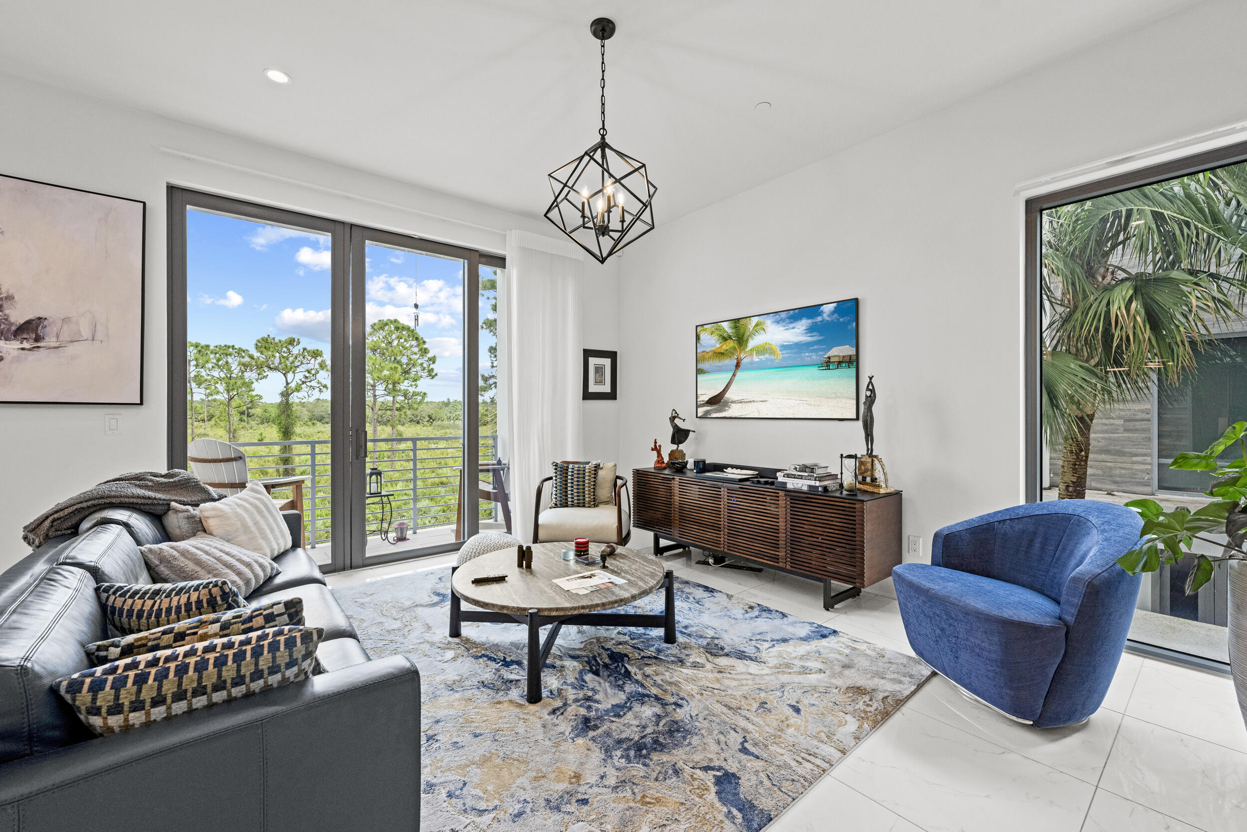 1811 Northwest 42nd Drive Boca Raton, FL 33431 - Photo 7 of 51 a living room with furniture and floor to ceiling windows