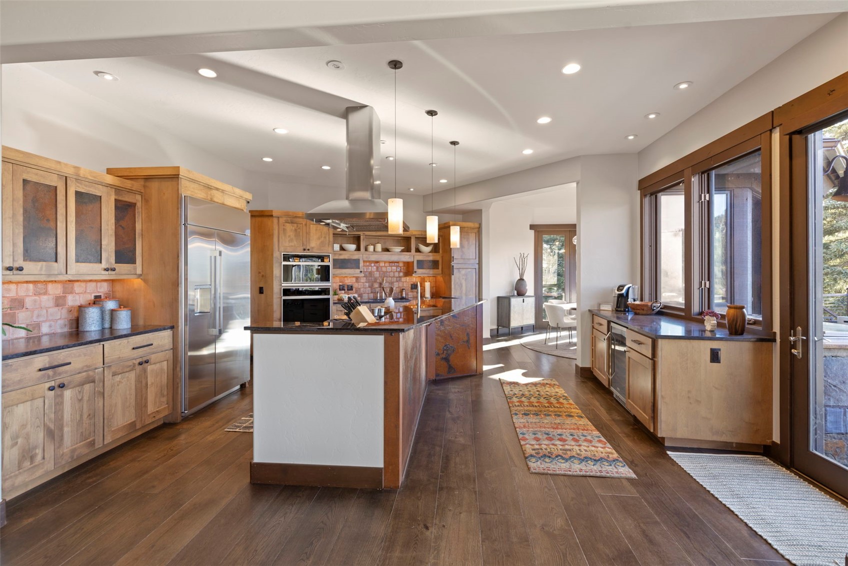 436 Gold Run Road Breckenridge, CO 80424 - Photo 12 of 50 Chef's kitchen featuring 2 sinks and a large wet bar (right).