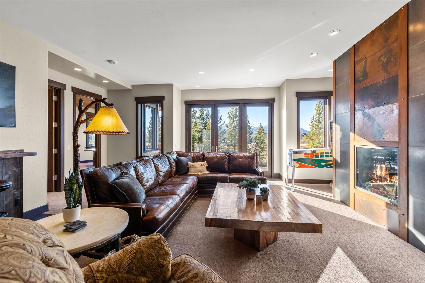 436 Gold Run Road Breckenridge, CO 80424 - Photo 30 of 50 Lower-level family room with 10' high ceilings, 8' doors, and a walk-out patio.