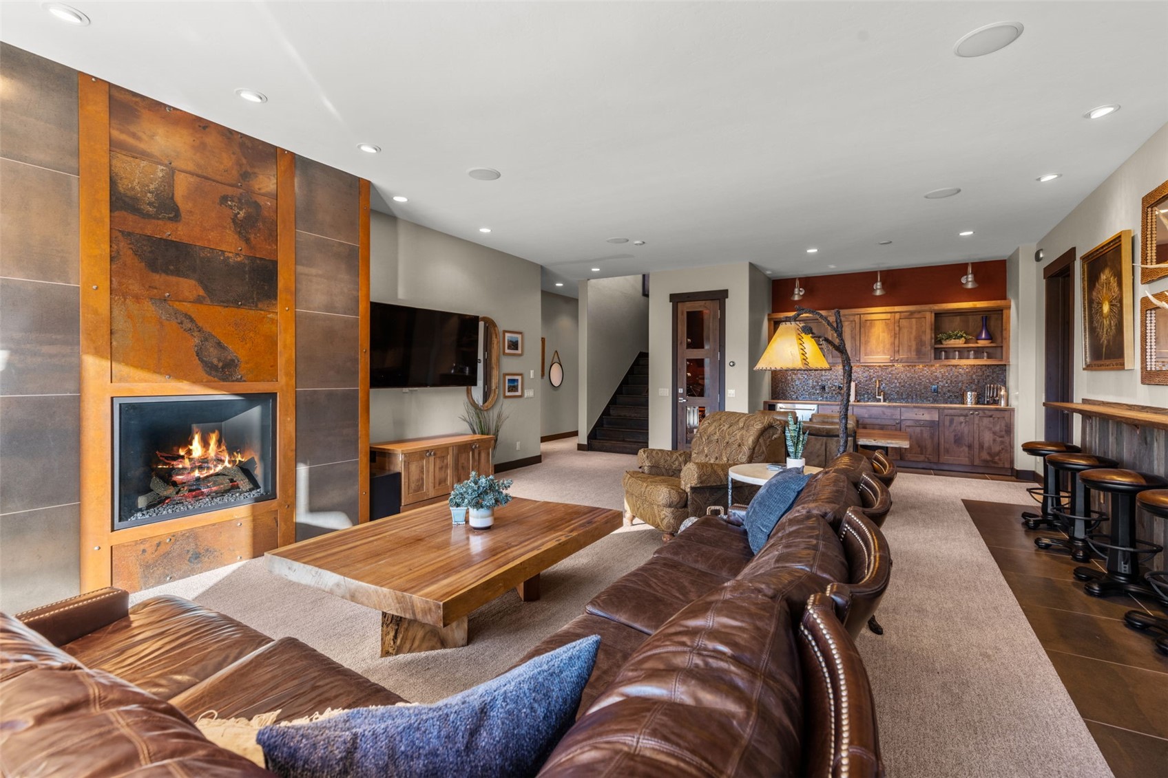 436 Gold Run Road Breckenridge, CO 80424 - Photo 31 of 50 Rustic metal gas fireplace setting the tone for this space!