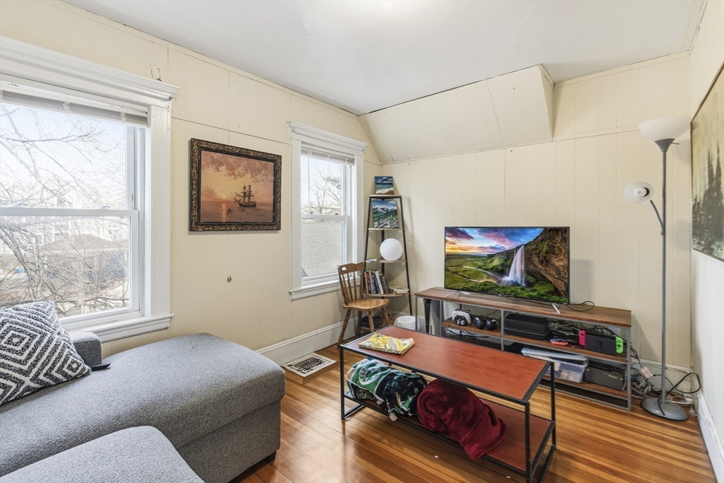 78 R Mt Vernon Street Somerville, MA 02145 - Photo 17 of 32 a living room with furniture and a flat screen tv