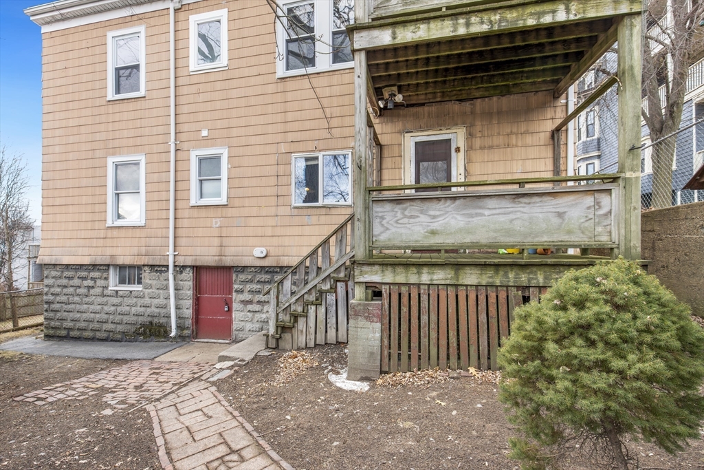 78 R Mt Vernon Street Somerville, MA 02145 - Photo 28 of 32 a front view of a house with a garage