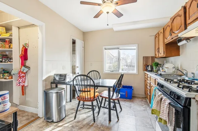 a bathroom with a sink a toilet and shower curtain