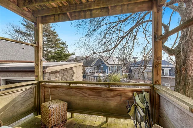 a kitchen with stainless steel appliances kitchen island a table and chairs in it
