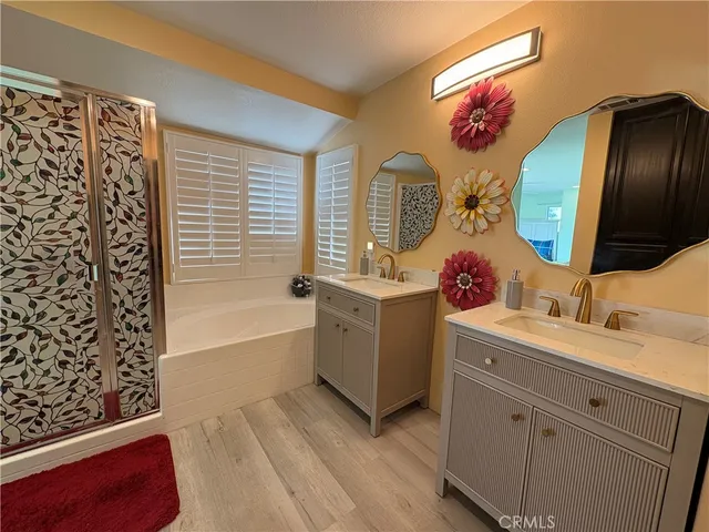 a bathroom with a sink mirror and vanity