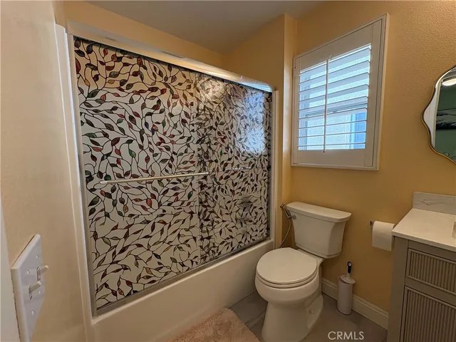 a bathroom with a toilet and a sink