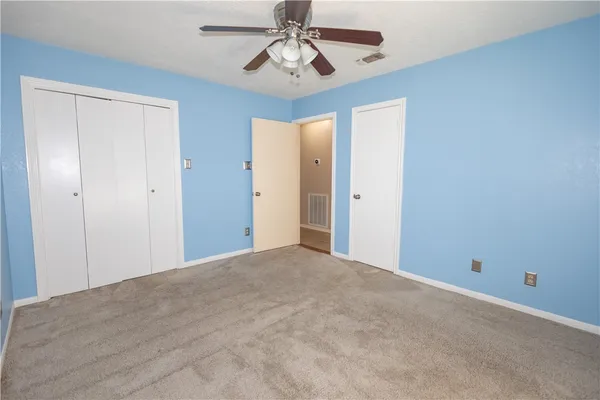 a view of a chandelier fan in a room