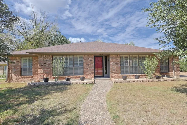 a front view of a house with a patio
