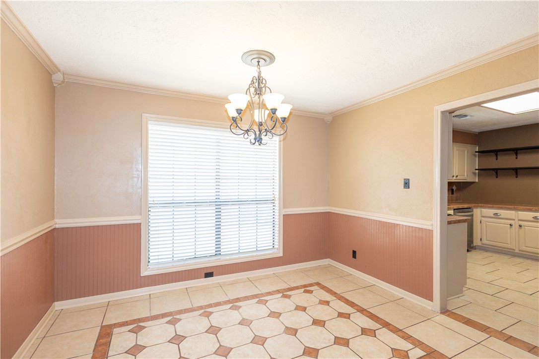 2903 Par Drive Bryan, TX 77802 - Photo 9 of 26 a big room with chandelier and windows