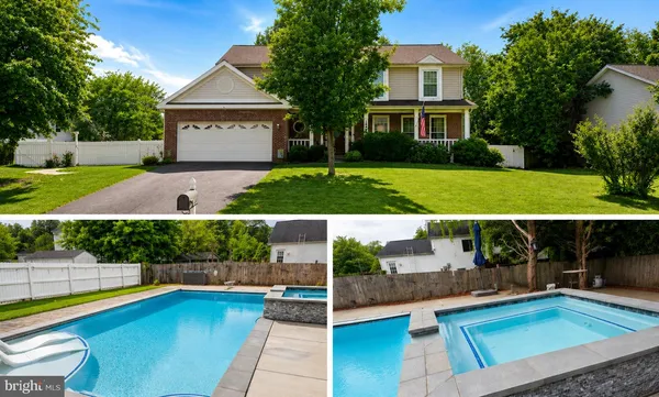 a view of house with swimming pool outdoor seating