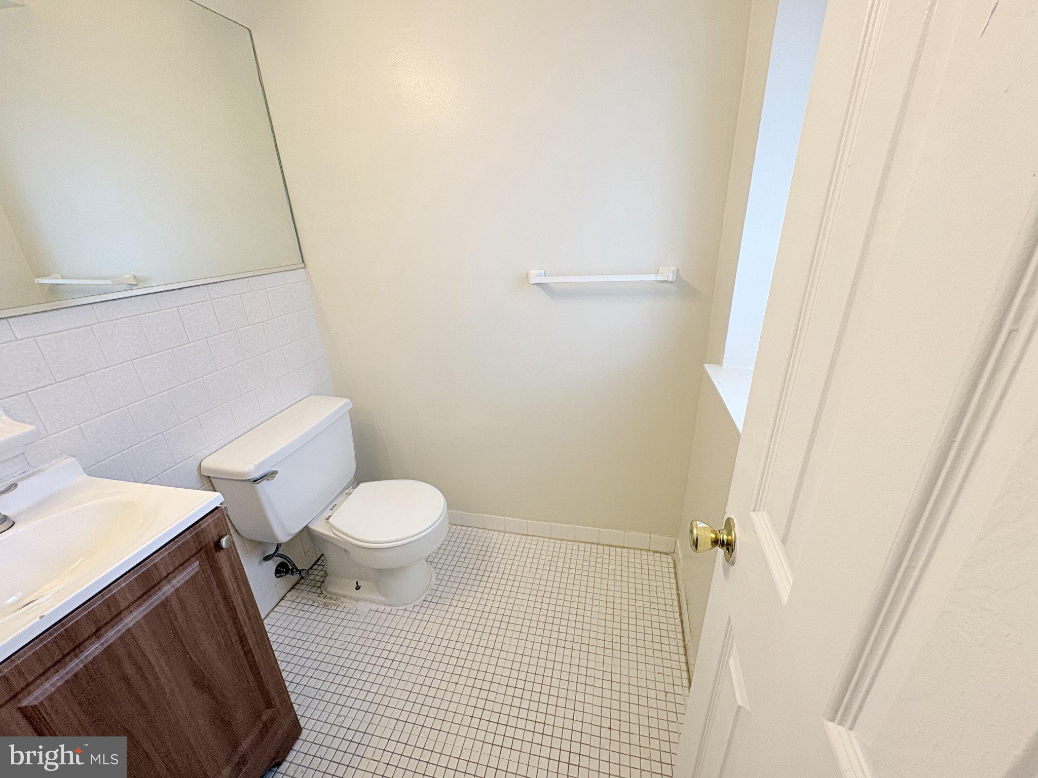 11905 I Tarragon Road, Unit I Reisterstown, MD 21136 - Photo 13 of 13 a white toilet sitting next to a shower